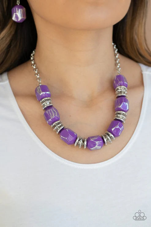 Featuring a scratched metallic finish, faceted purple beads and shimmery silver accents are threaded along an invisible wire below the collar for a colorful look. Features an adjustable clasp closure. Sold as one individual necklace. Includes one pair of matching earrings.