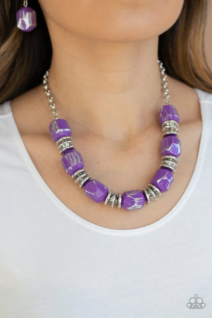 Featuring a scratched metallic finish, faceted purple beads and shimmery silver accents are threaded along an invisible wire below the collar for a colorful look. Features an adjustable clasp closure. Sold as one individual necklace. Includes one pair of matching earrings.