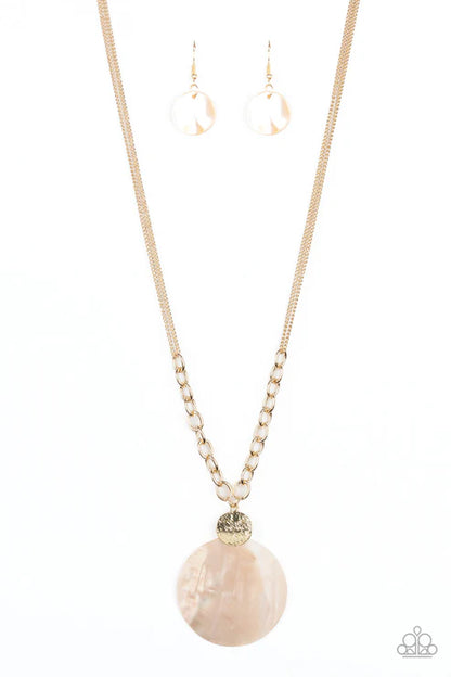 Necklace with a large pink stone pendant and matching earrings on a white background