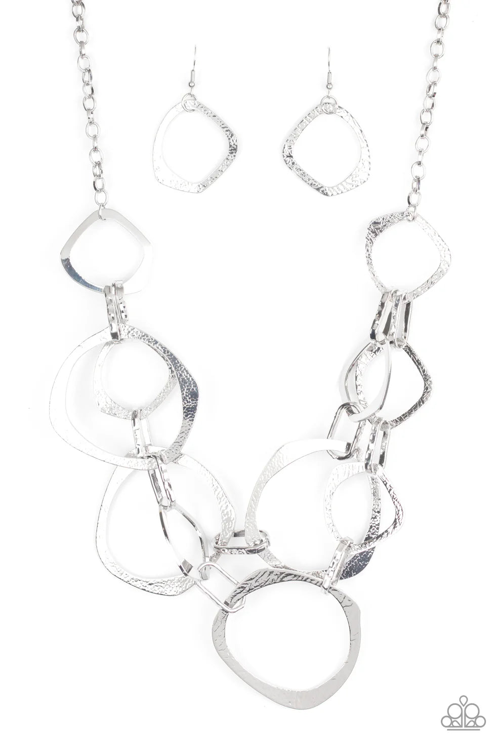 Silver necklace with interlocking rings on a white background