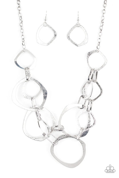 Silver necklace with interlocking rings on a white background