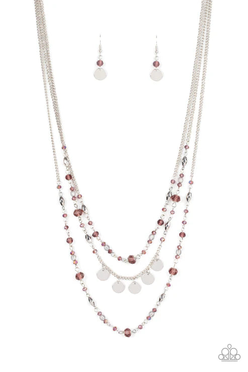 Necklace and earrings set with purple and silver beads on a white background