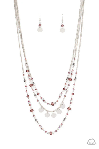 Necklace and earrings set with purple and silver beads on a white background