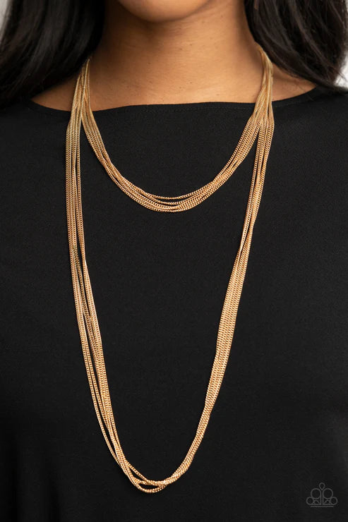 Gold necklace on a black background