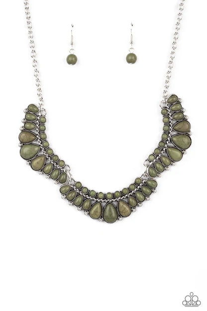 Necklace with green stones and silver chain on a white background