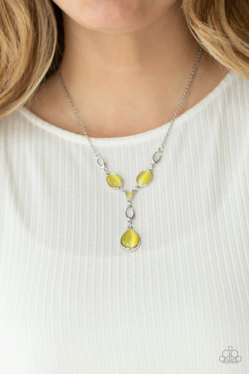 Necklace with yellow teardrop pendants on a white background