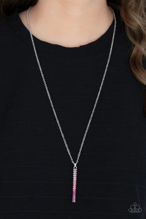 Necklace with a pink pendant on a black background