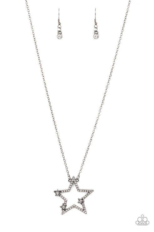 Star-shaped necklace with matching earrings on a white background