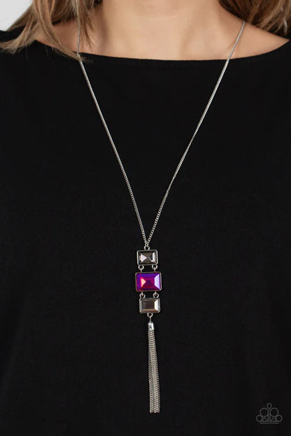 Necklace with purple gem and tassel on a black background