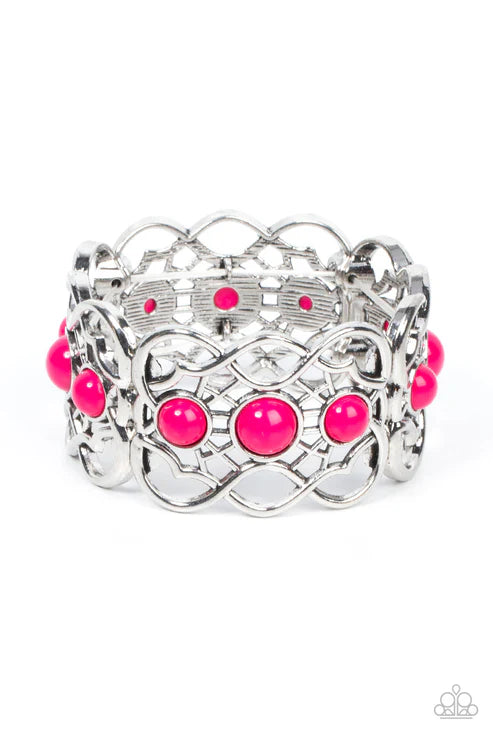 Silver bracelet with pink beads on a white background