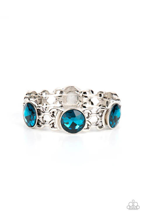 Silver ring with blue gemstones on a white background