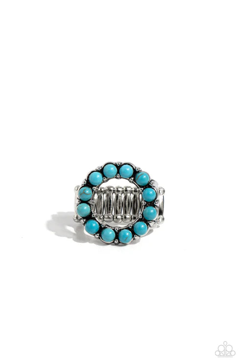 Turquoise beaded ring with silver band on a white background