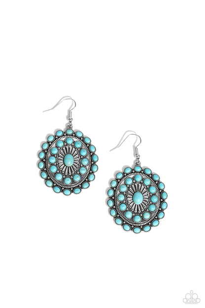 Turquoise and silver earrings on a white background