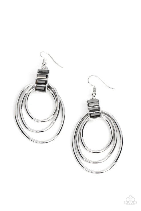 Pair of silver hoop earrings on a white background