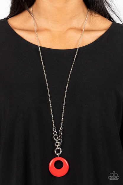 Necklace with a red pendant on a black background