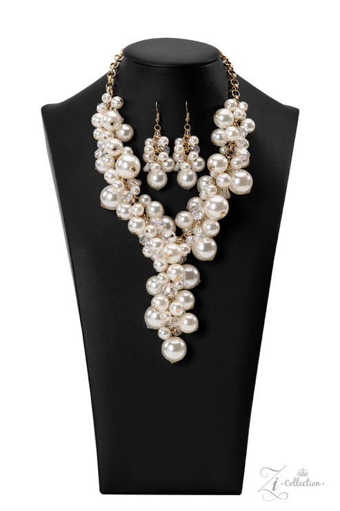 Pearl necklace and earrings set on a black mannequin bust with 'Jewelry Collection' branding.