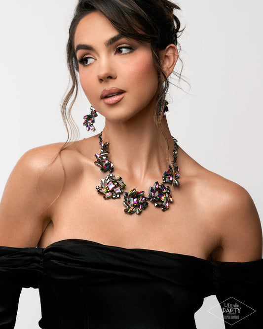 Woman wearing a sparkling necklace and earrings on a plain background