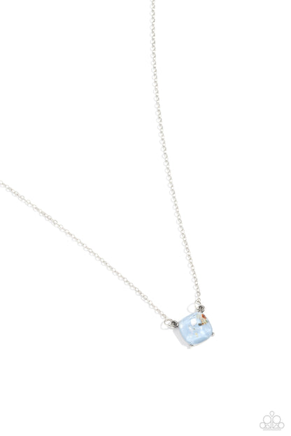 Necklace with a blue gemstone pendant on a white background