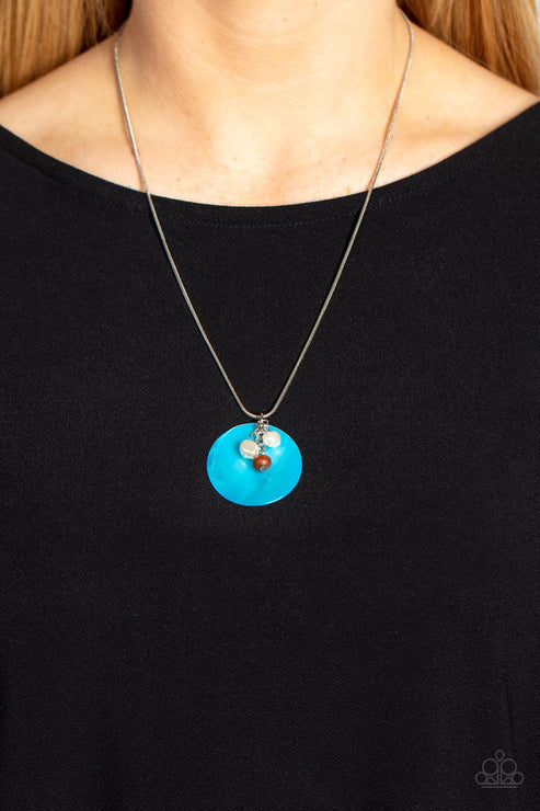 Necklace with a blue pendant on a black background