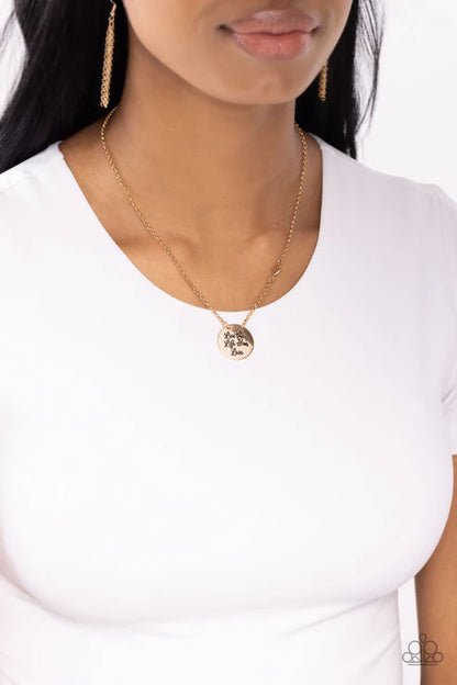 Gold necklace with a pendant on a white background