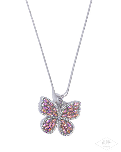 Butterfly-shaped pendant necklace with pink gemstones on a white background
