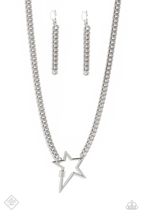 Silver star necklace and earrings on a white background