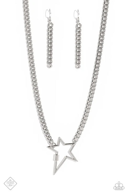 Silver star necklace and earrings on a white background