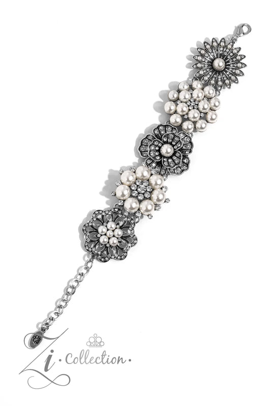 Elegant bracelet with floral designs and pearls on a white background, featuring the Zi Collection logo.