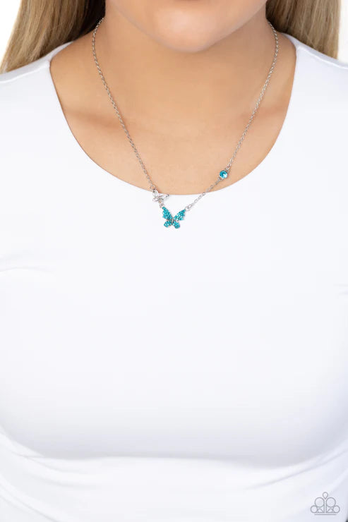 Necklace with blue butterfly pendant on a white background
