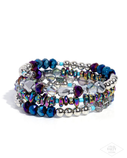 Multistrand beaded bracelet with blue, silver, and iridescent beads on a white background