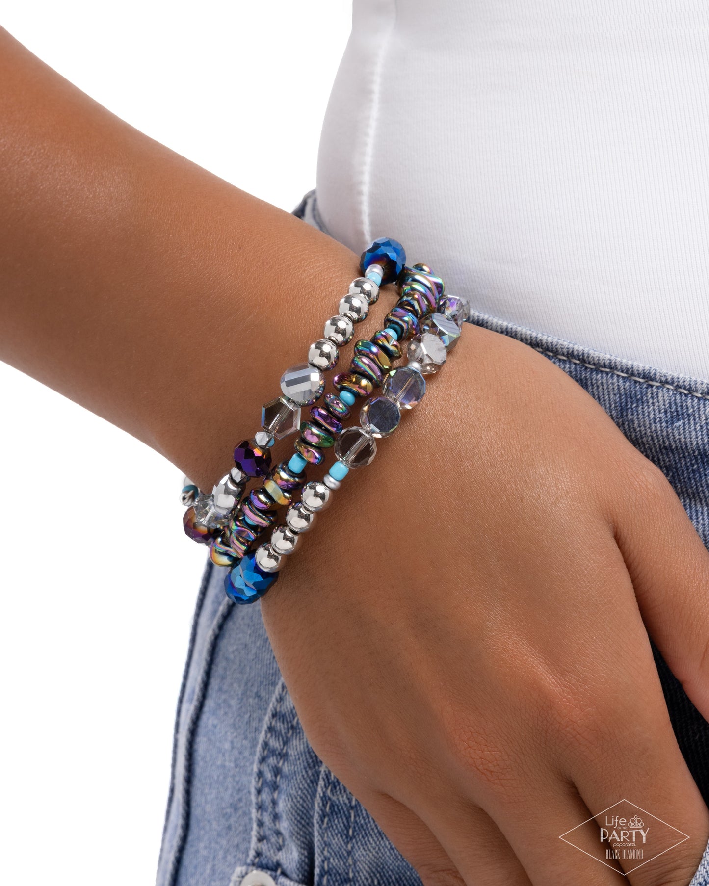 Multicolored beaded bracelet on a wrist with a white background