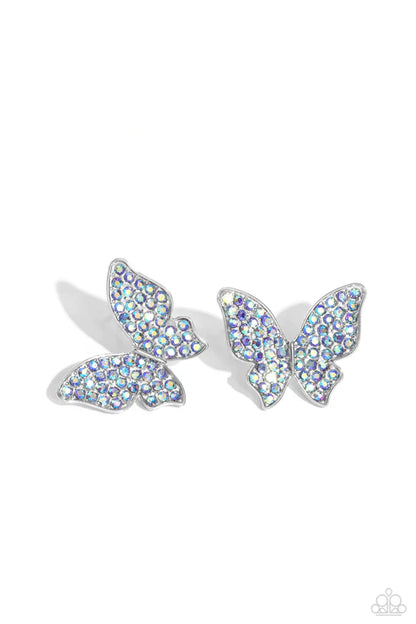 Butterfly-shaped earrings with iridescent gemstones on a white background