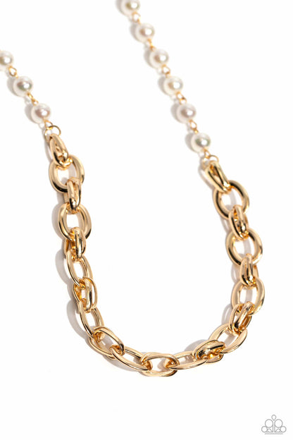 Gold chain necklace with pearls on a white background