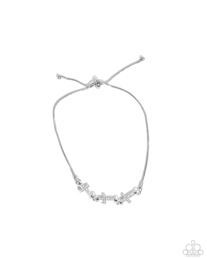 Silver adjustable bracelet with star-shaped charms on a white background