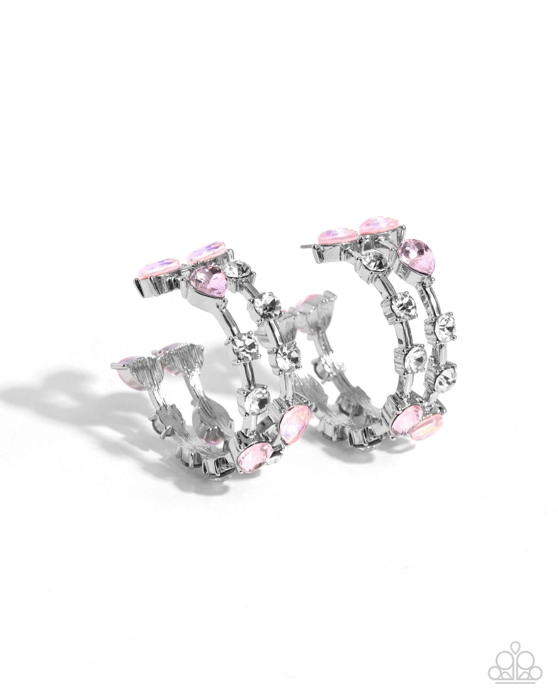Silver-tone hoop earrings adorned with clear rhinestones and light pink teardrop and oval crystals, shown on a clean white background.