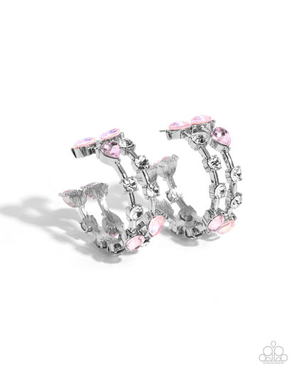 Silver-tone hoop earrings adorned with clear rhinestones and light pink teardrop and oval crystals, shown on a clean white background.