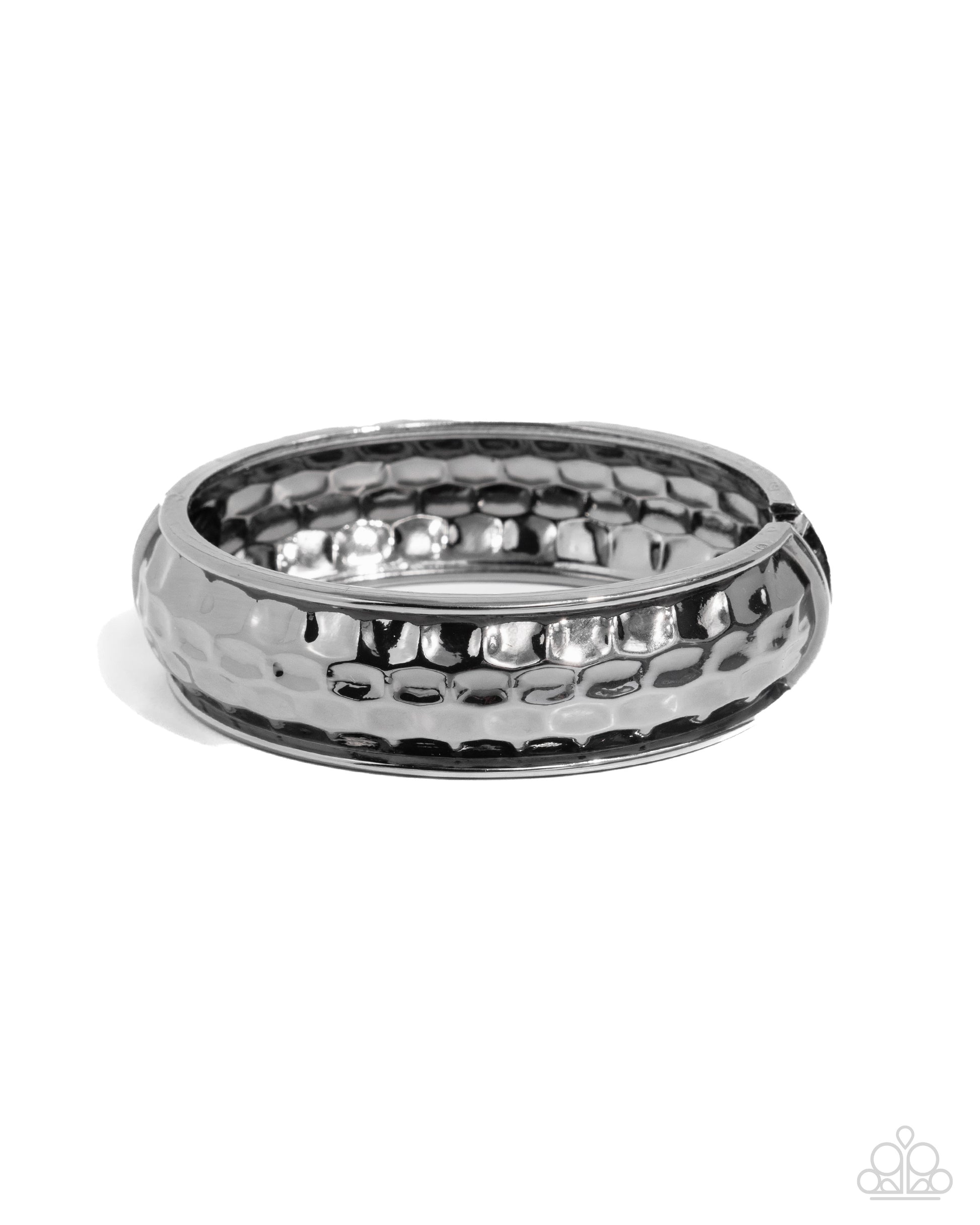 Silver ring with textured design on a white background