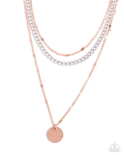 Three layered necklaces with copper silver chains on a white background