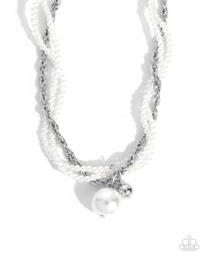 Necklace with pearls and silver accents on a white background