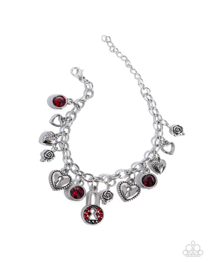Silver bracelet with various charms on a white background