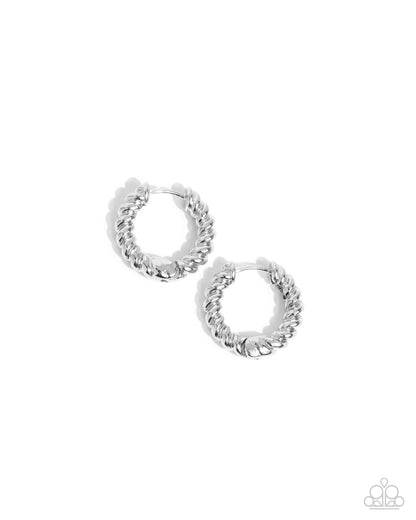 Pair of silver hoop earrings on a white background