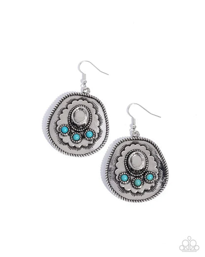 Pair of silver earrings with turquoise stones on a white background