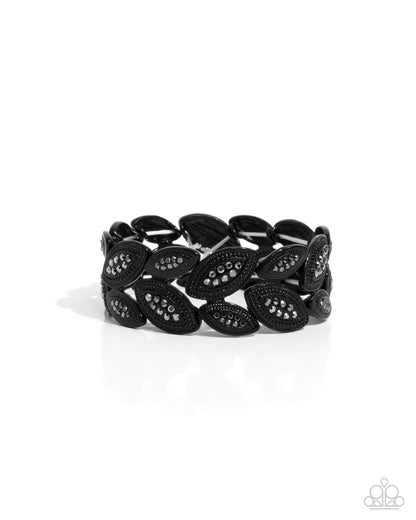 Black leaf-shaped bracelet on a white background