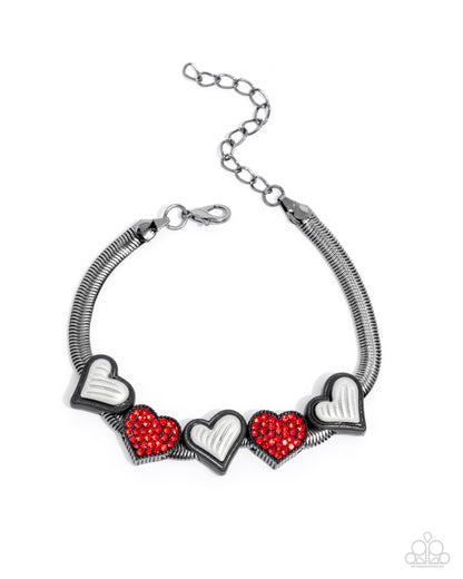 Bracelet with heart-shaped charms on a white background