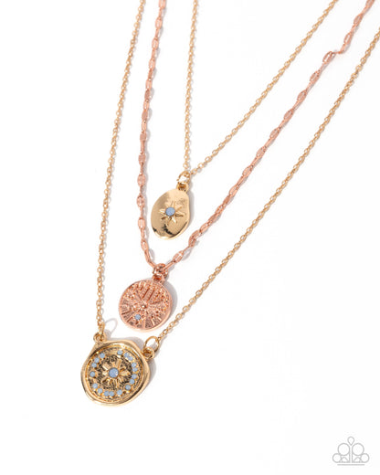 Three rose gold necklaces with circular pendants on a white background
