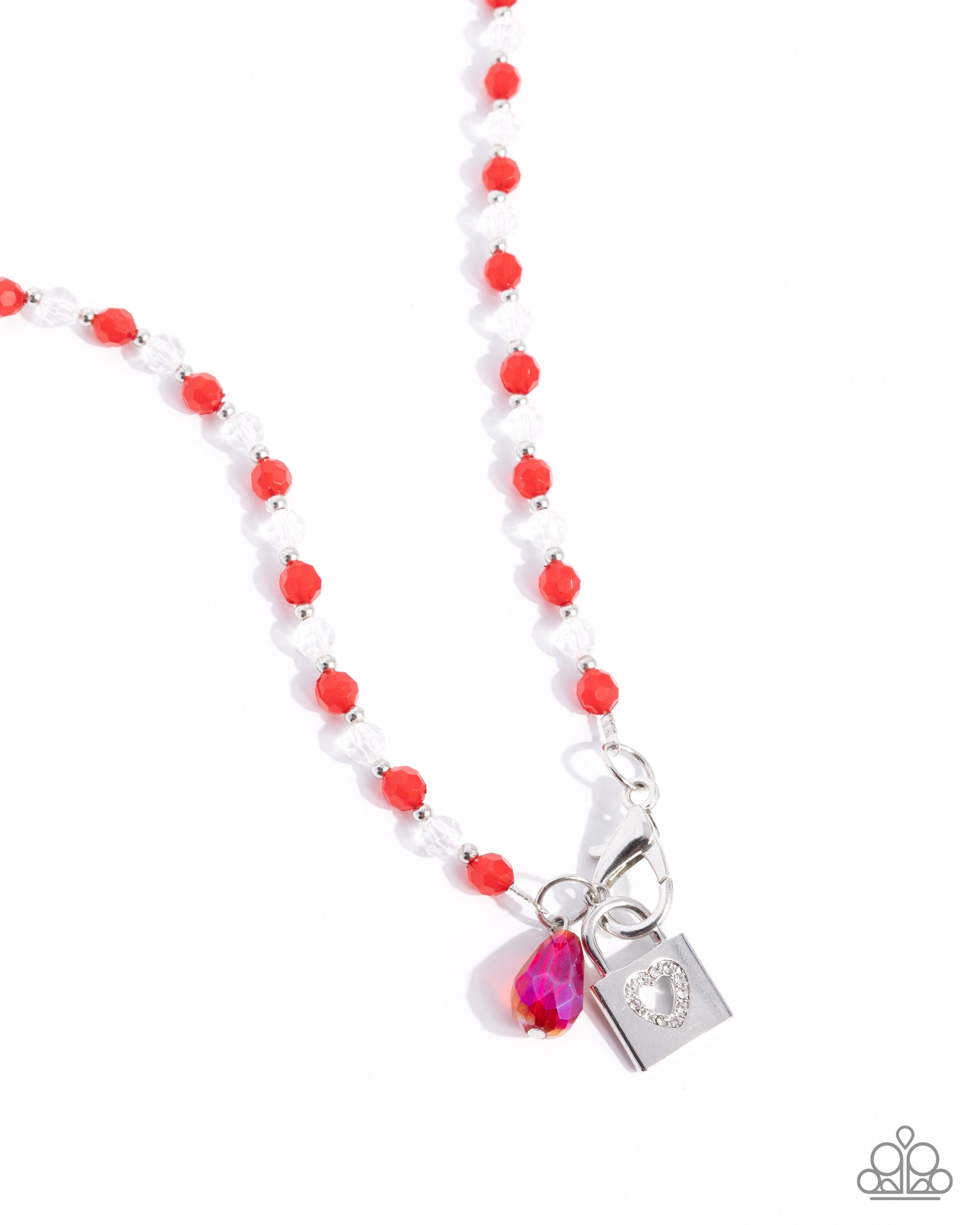 Necklace with red and white beads and a silver bow pendant on a white background