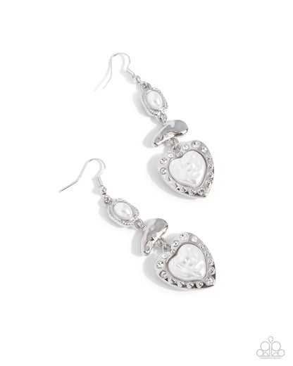 Pair of silver heart-shaped earrings on a white background