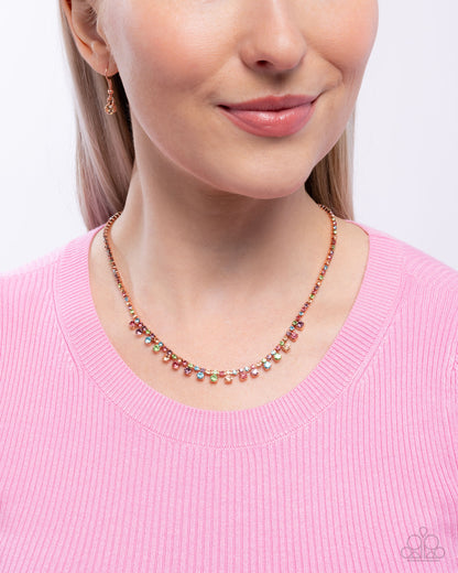 Necklace worn by a model against a pink background