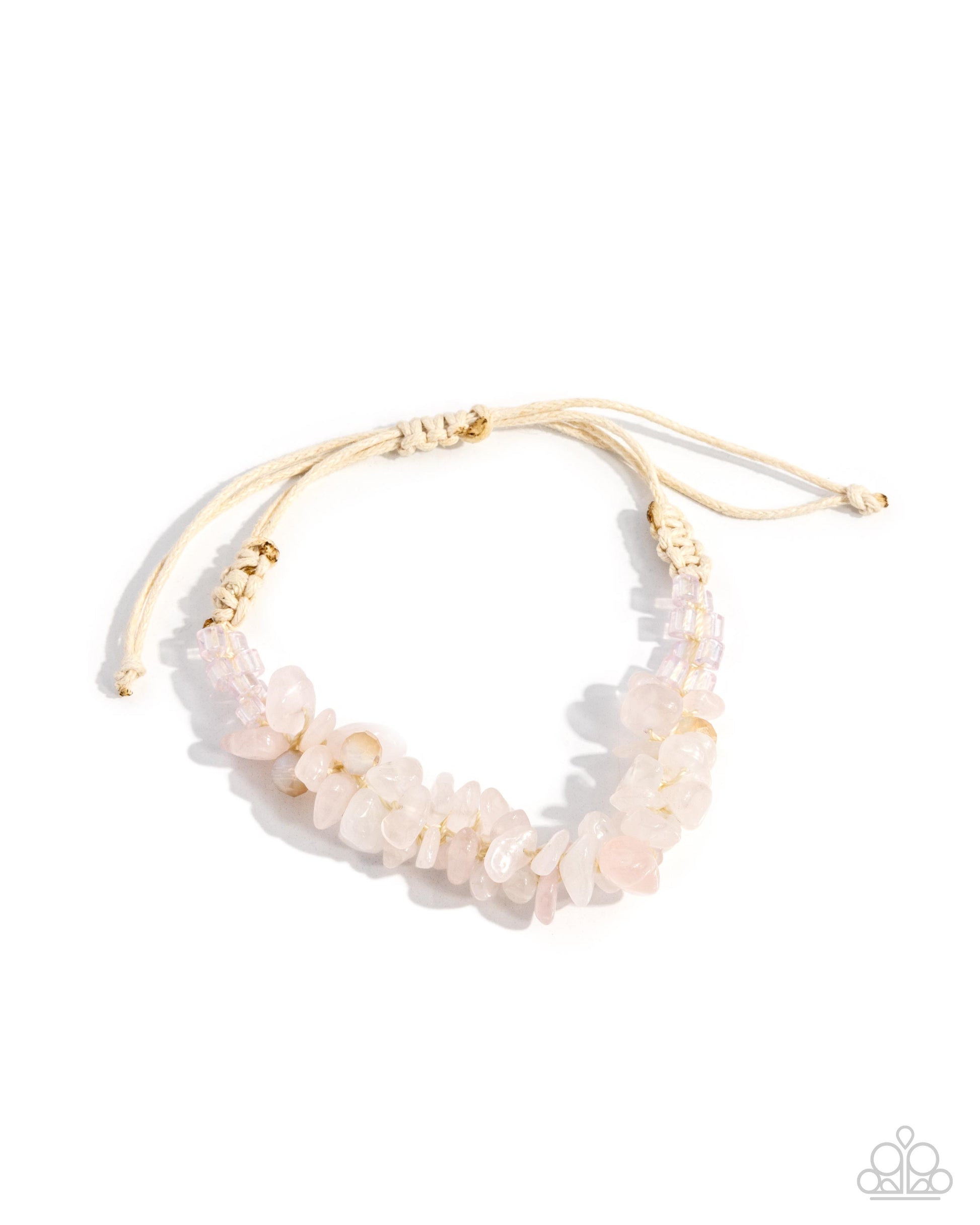 Necklace with pink stones and gold accents on a white background