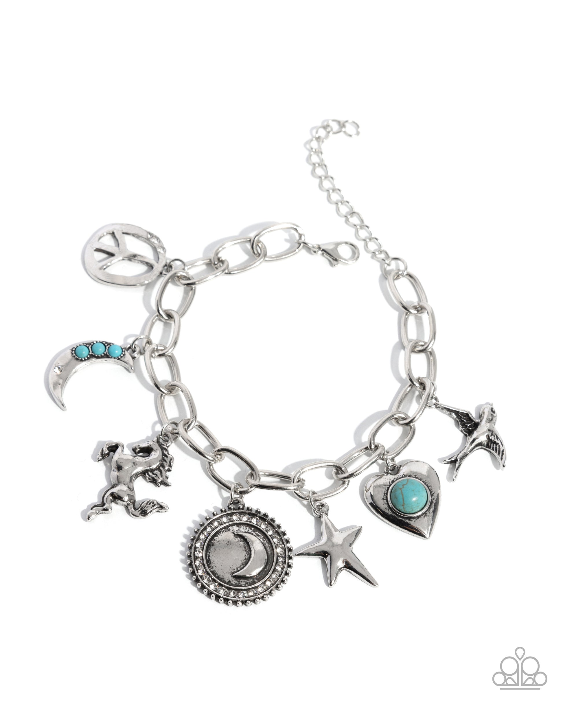 A silver-tone charm bracelet featuring multiple celestial and mystical charms, including a crescent moon with turquoise accents, a lion, a star, a heart, and a peace sign, displayed on a clean white background.